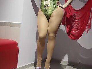 Sexy crossdresser in highheels Green swim suit girl facemask - ashemaletube.com